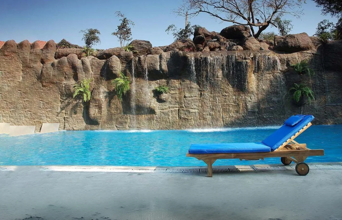 Lagoon pool with rock cascades at Windflower, Mysore